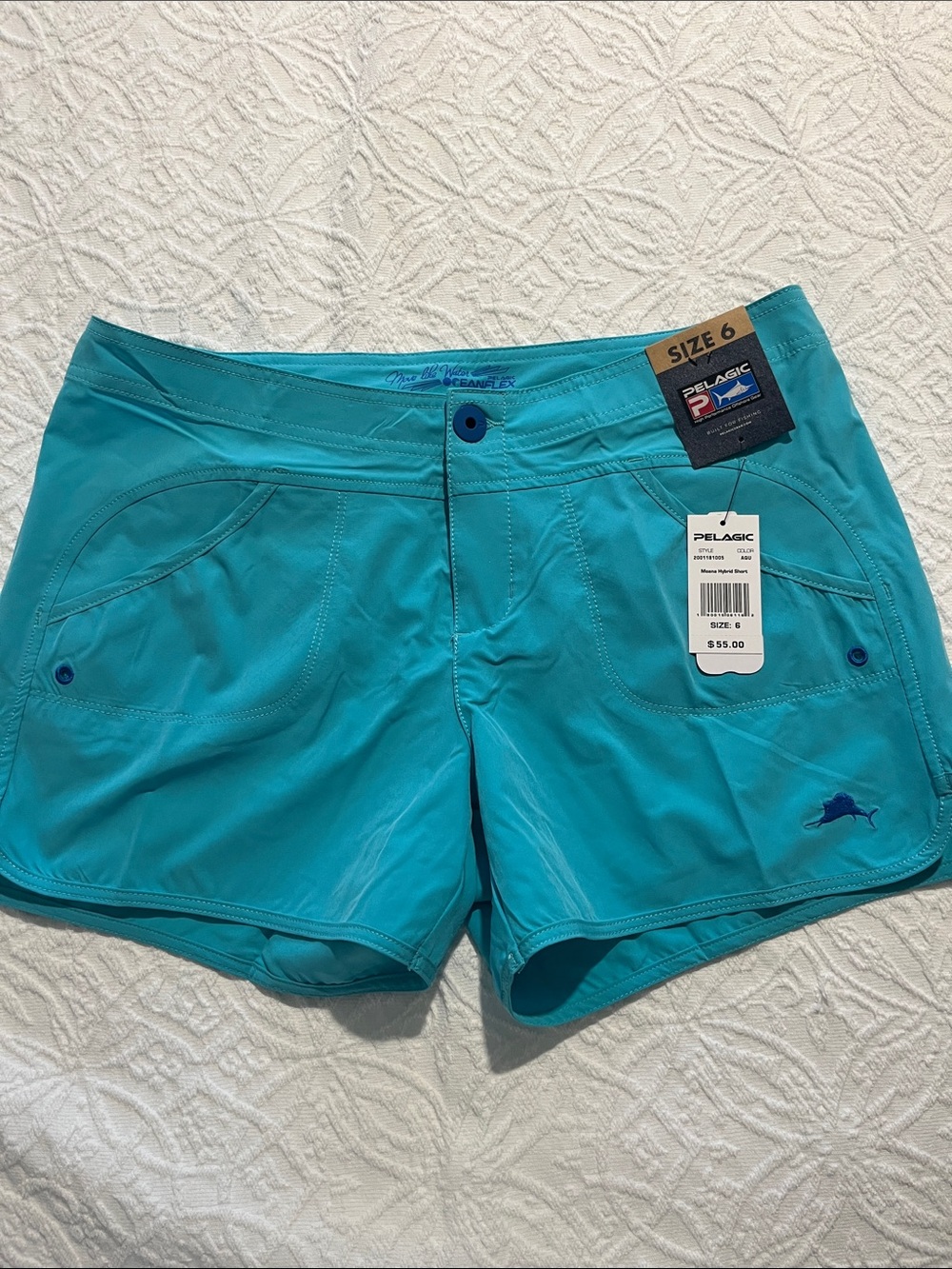 Pelagic Women’s Turquoise Athletic Shorts with Blue Accent